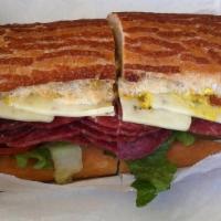 Salami · Includes mayonnaise, mustard, lettuce, tomato, pickle, onion and our sun-dried tomato tapena...