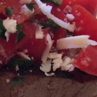 Bruschetta · Toasted bread, fresh tomato, basil, garlic, and extra virgin olive oil.
