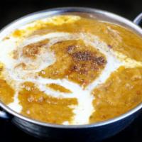 Chicken Korma · Boneless chicken pieces cooked in a mild cashew, golden raisins and saffron sauce