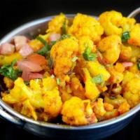 Aloo Gobi · Fresh cauliflower and potatoes cooked with onions, turmeric and fresh herbs.