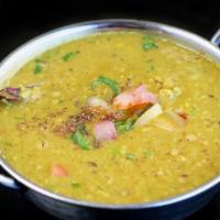 Yellow Dal (Lentills) · Yellow lentils delicately spiced with garlic, cumin, and coriander.
