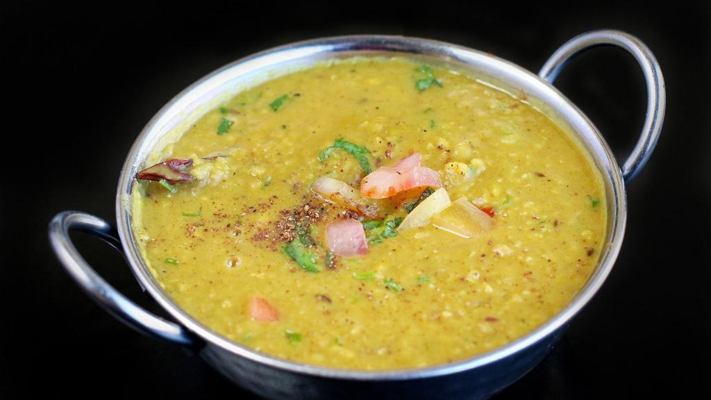 Yellow Dal (Lentills) · Yellow lentils delicately spiced with garlic, cumin, and coriander.