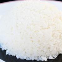 Basmati Rice · Plain white long grain rice with peas on top.