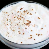 Raita · A refreshing blend of yogurt, spices, cucumbers and carrots.