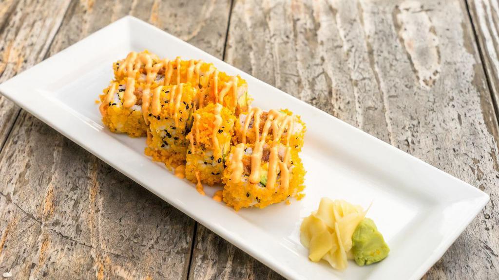 Crunchy Spicy Salmon Roll · Spicy salmon, avocado topped crispy tempura bits and spicy mayo.