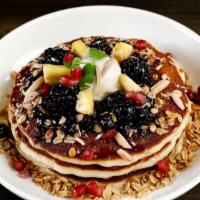 Greek Yogurt Pancakes · Seasonal fruit, honey, blueberry compote & toasted almonds
