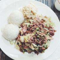 21. Kalua pork with Cabbage · Smoked-flavored, succulent shredded pork slowly roasted to a flavorful finish and mixed with...