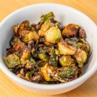 Sautéed Brussels Sprouts · With sage-garlic brown butter.