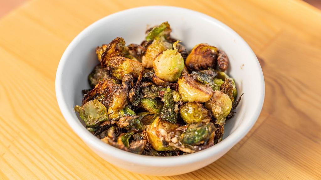 Sautéed Brussels Sprouts · With sage-garlic brown butter.