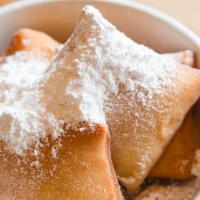 Beignets · French style pastry pillows cooked to order & served with powdered sugar. Add bourbon vanill...