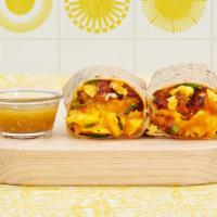 Spicy Hot Breakfast Burrito · Two scrambled eggs, jalapenos, hash browns, sriracha and melted cheese wrapped in a fresh fl...