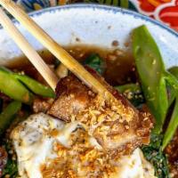 Kana Moo Krob  · Stir-fried crispy pork belly and Gailan Chinese broccoli with garlic oyster sauce. (Fried eg...