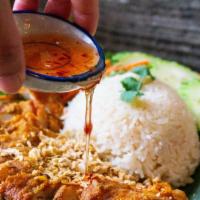 Khao Mun Gai TOD · Thai style Fried Chicken over Herb-Garlic & Ginger rice.  Serve with cucumber and sweet & so...
