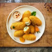 Papi Peno Popper  · Fresh jalapenos coated in cream cheese and fried until golden brown.