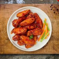 Buffy Buffalo Wings · Fresh chicken wings breaded, fried until golden brown, and tossed in buffalo sauce. Served w...