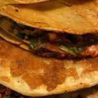 Birria Taco (Quesabirria) · Beef Birria on grilled corn tortilla with 
cheese, onions, cilantro and side of 
consume (be...