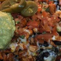 Super Nachos with Meat · Choice of meat, Steak, chicken. carnitas or al pastor, sour cream, guacamole, jalapenos and ...