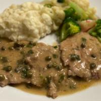 Chicken Piccata
 · Tender chicken breast sautéed in a light brown sauce, capers and lemon served with mashed po...