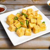 Crispy Tofu W/ Salt & Chilli Peppers · Crispy tofu cooked with chili peppers and garnished with salt.
