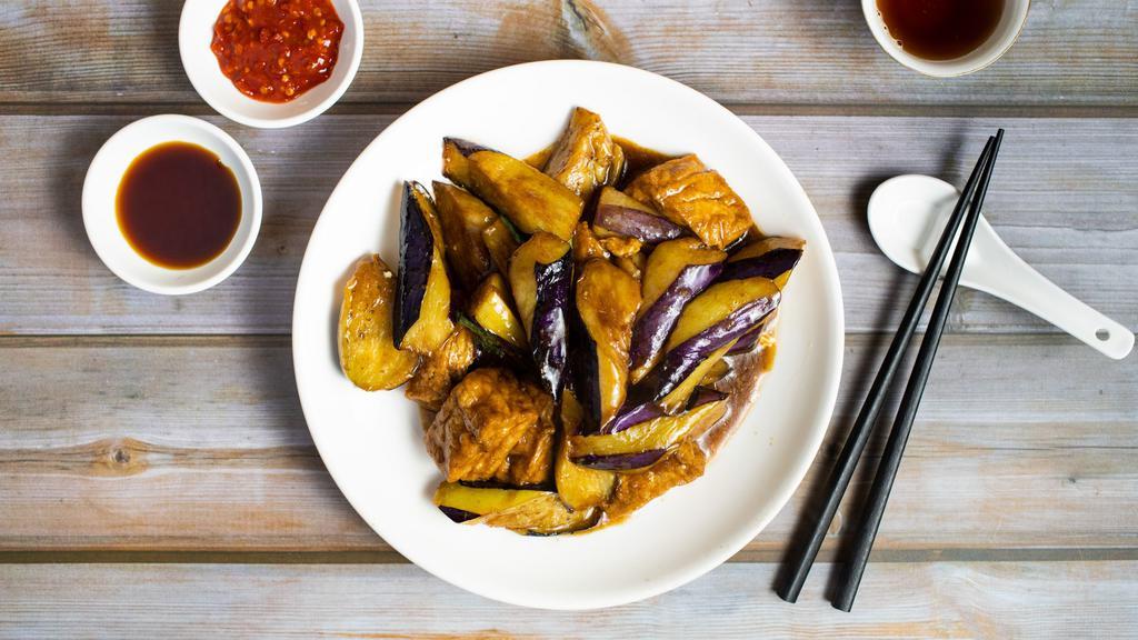 Eggplant, Tofu & Basil W/ Satay Sauce · Eggplant, and fried tofu stir fried in a satay peanut sauce. Garnished with basil.