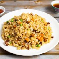 House Fried Rice · Vegan ham with carrot peas cooked and stir fried with rice. Substitute brown rice for an add...