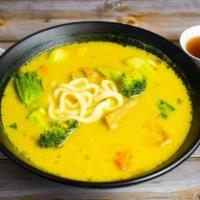 Curry Tofu Udon Soup W/ Vegetables · Assortment of tofu, vegetables and noodles cooked in a curry udon roth.
