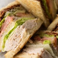 Our Famous Club · Choice of toasted white, wheat or sourdough bread.                     Towering sandwich wit...