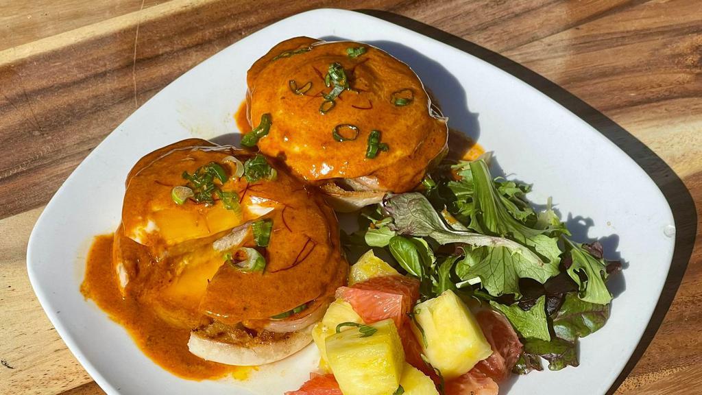 Spam Eggs Benedict · English Muffin, Poached Eggs, Spam smothered in a Cajun Garlic Sauce. Comes with House Salad and Fresh Grapefruit Pineapple Salad