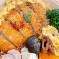 Chicken Katsudon · Golden fried chicken cutlet with savory-sweet onions cooked in dashi and eggs over white ric...