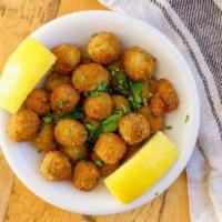 Anchovy Stuffed Fried Olives · lemon