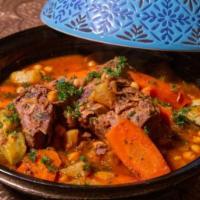 Tajine · Gluten free. Your choice of braised chicken or lamb with vegetables and preserved lemons.
