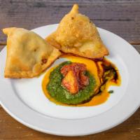Vegetarian Samosa Plate · Lightly fried white flour pastry stuffed with spiced potatoes, fresh green peas, and cilantr...