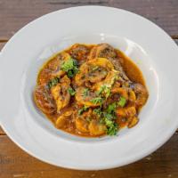 Lightly Curried Button Mushrooms · Button mushrooms simmered in a very light and mild curry reduction.