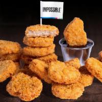 20 PIECE IMPOSSIBLE™ CHICKEN NUGGETS · 20 Crispy fried Impossible™ chicken nuggets; served with choice of dipping sauce