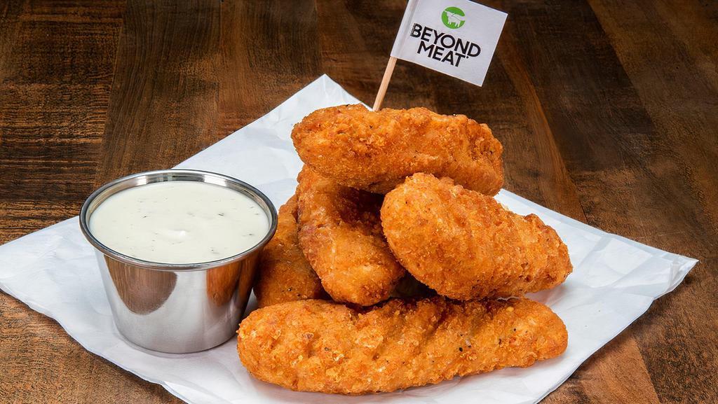 Beyond® Tenders · 5 crispy fried beyond® tenders; served with a dipping sauce.
