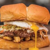 The Freiburger® · White American cheese, fries, Haus slaw, fried egg, mayo. Now made with a 6oz patty!!