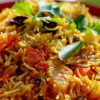 The Vegetable Biryani · An exotic blend of basmati rice, assorted farmers market vegetables and traditional spices a...