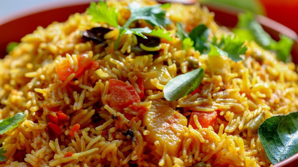 The Vegetable Biryani · An exotic blend of basmati rice, assorted farmers market vegetables and traditional spices and herbs.