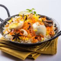 Egg Biryani · Aromatic rice dish made with basmati rice, cooked with boiled egg and herbs.