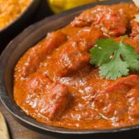 The Chicken Tikka Masala · Fresh boneless tender pieces of chicken cooked with tomatoes and flavored with Indian herbs.
