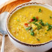 Famous Dal (Lentil) · Famous dal curry made with fresh yellow lentils mixed with red chili powder and garlic. Serv...