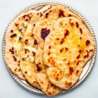 Butter Naan · Indian tandoor naan topped with butter.
