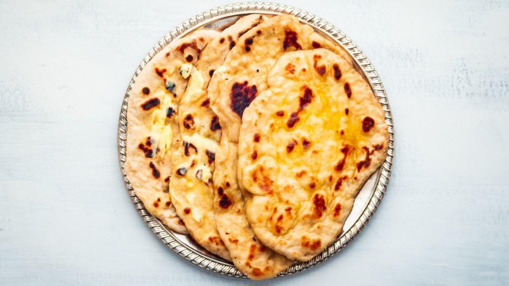 Butter Naan · Indian tandoor naan topped with butter.