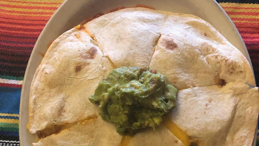 Cheese Quesadillas · Flour tortillas stuffed with melted cheese. Served with guacamole and lettuce.