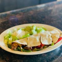 Fajita Quesadillas · A giant our tortilla filled with cheese, sautéed onions, bell peppers, carrots, and your cho...