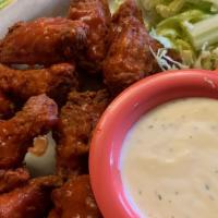 Celia's Hot Wings · Nine sumptuous wings served with ranch dressing, carrot and celery sticks.