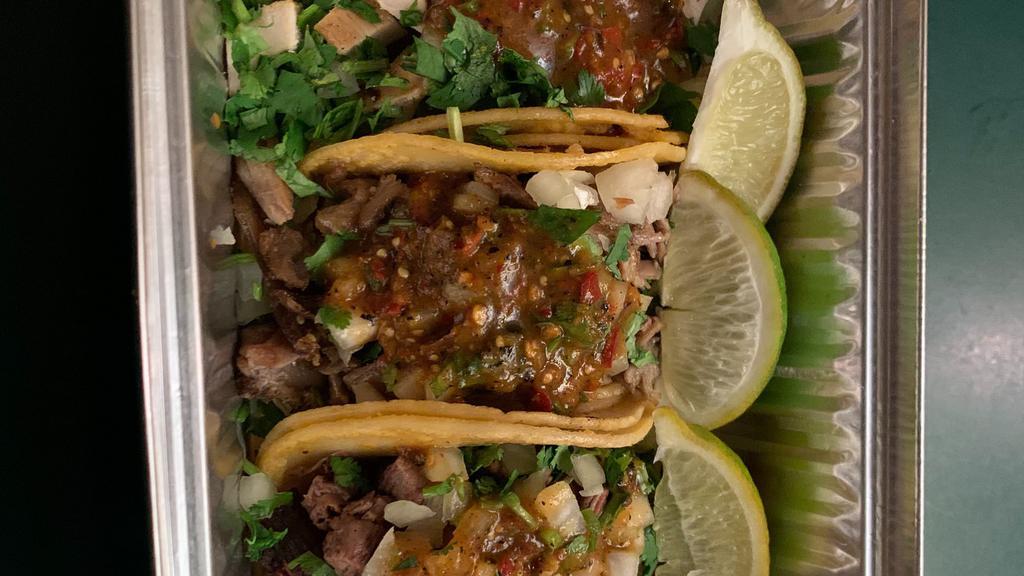 Taqueria Style Tacos · Three street tacos served with onions, cilantro and salsa. Choice of carne asada or pork carnitas.