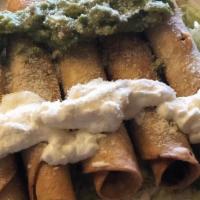 Fried Taquitos · 5 deep fried chicken or shredded beef taquitos. Served on a bed of lettuce topped with sour ...