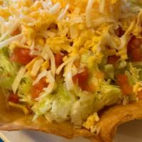 Tijuana Taco Salad · Your choice of beef, picadillo or chicken in a bowl shape our tortilla shell with beans, let...