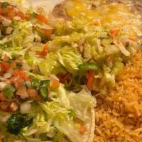 Tacos de Pescado · Catfish sautéed in butter and wine, served on two soft tortillas with lettuce and pico de ga...